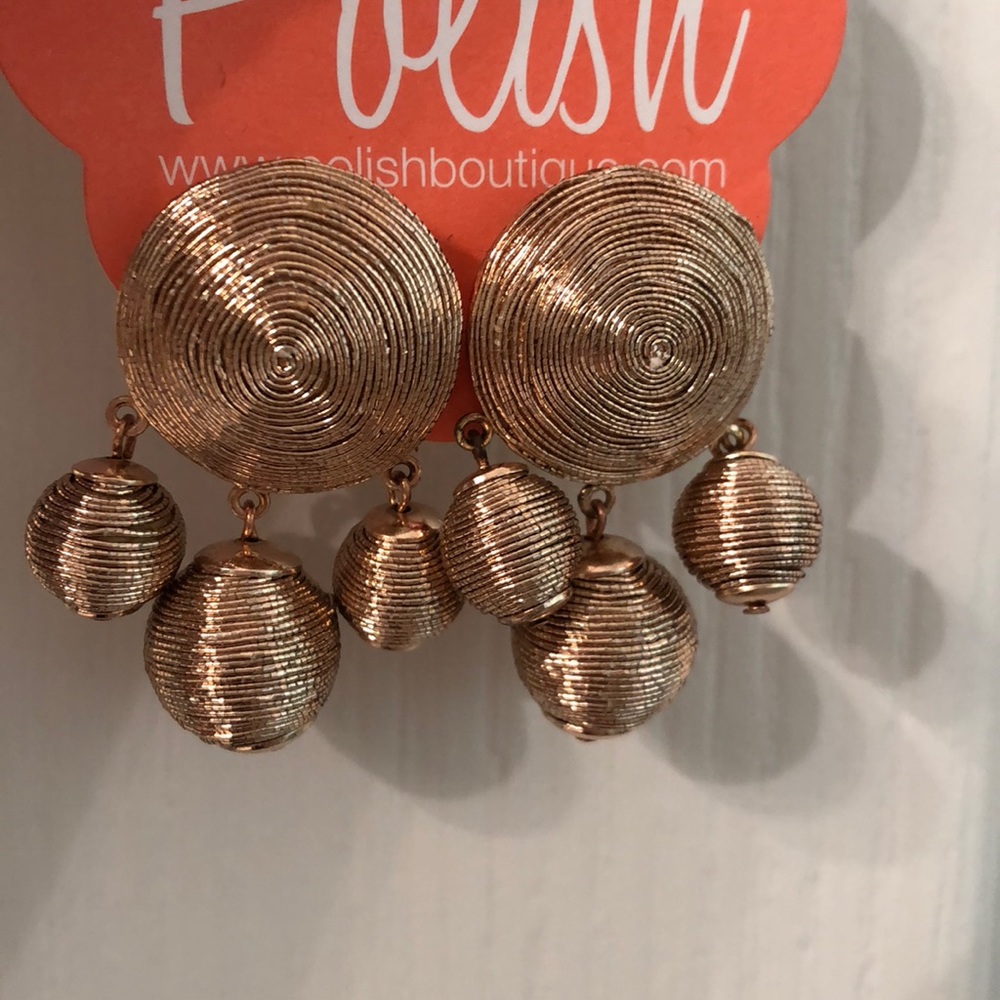 NWT never worn. Gold/brass tone earrings.